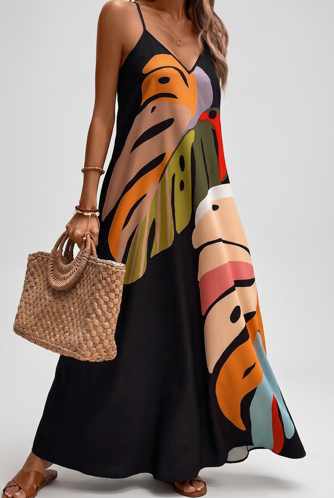 Vibrant Leaf Print Maxi Dress with Flowing Skirt