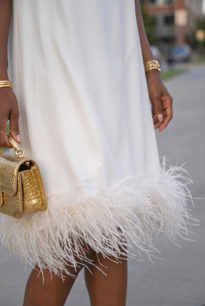 Elegant Sleeveless Midi Dress with Feather Hem Detail